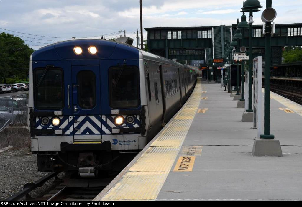 Inbound commuter out of its station stop